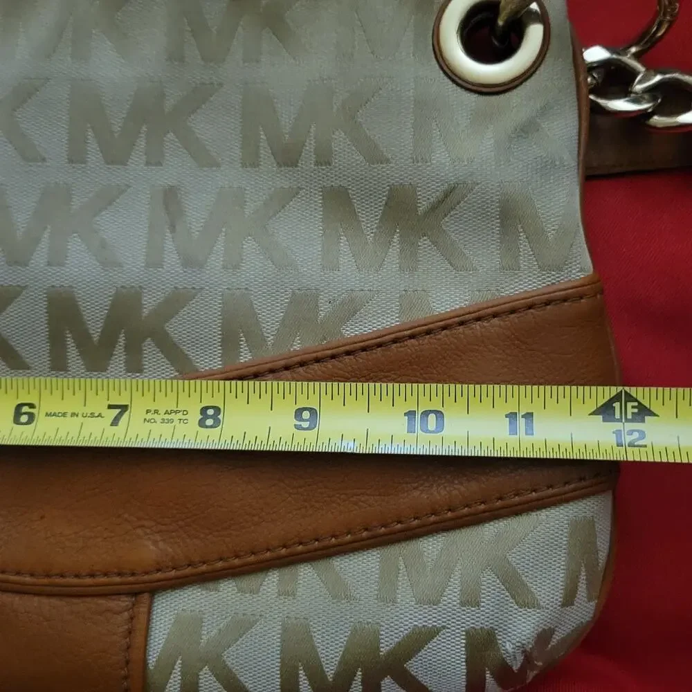 Michael Kors Jamesport Signature Handbag Tab with Leather and Gold Trim Striking